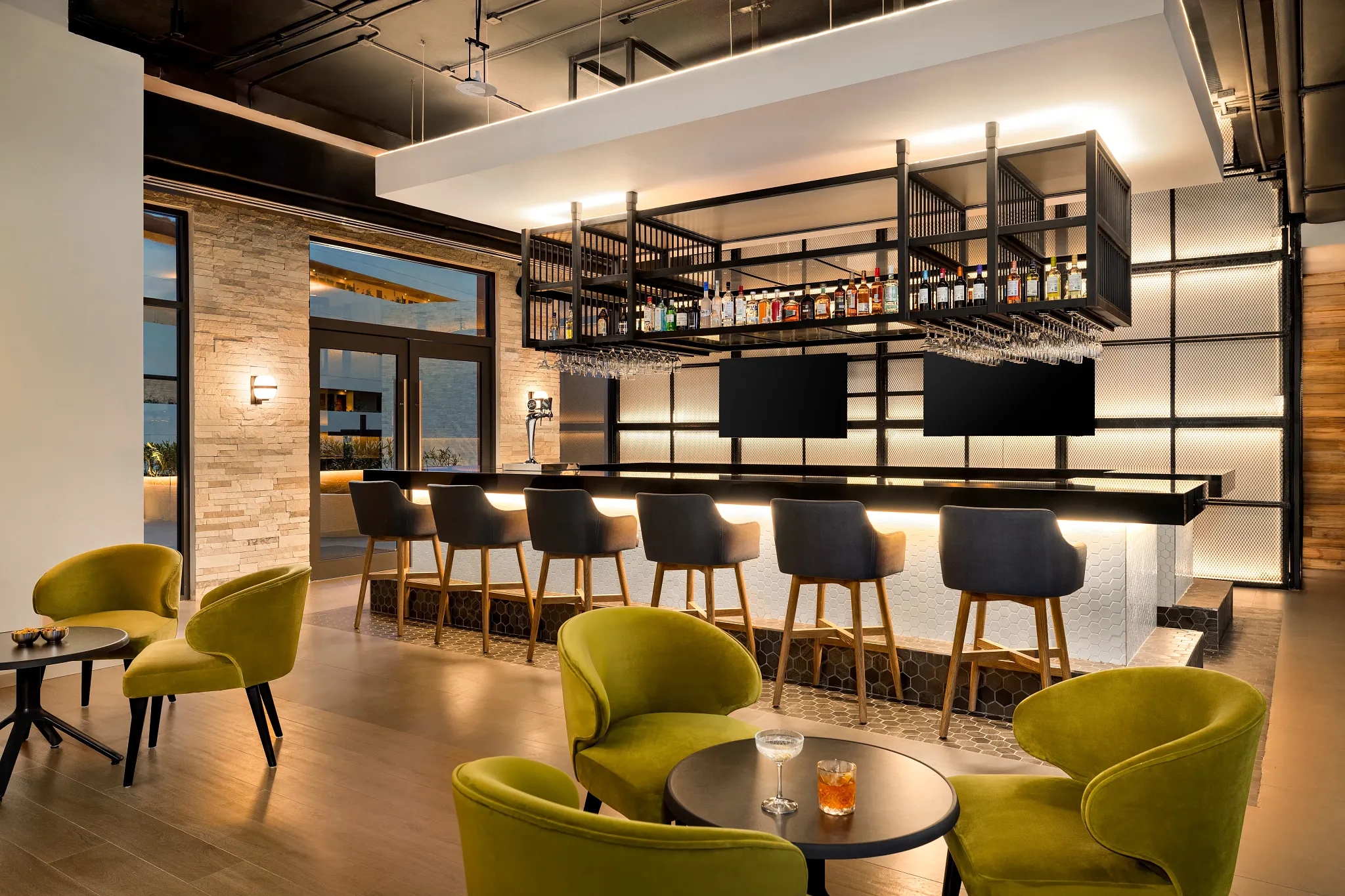 Sports bar with seating area and bar with a variety of drinks