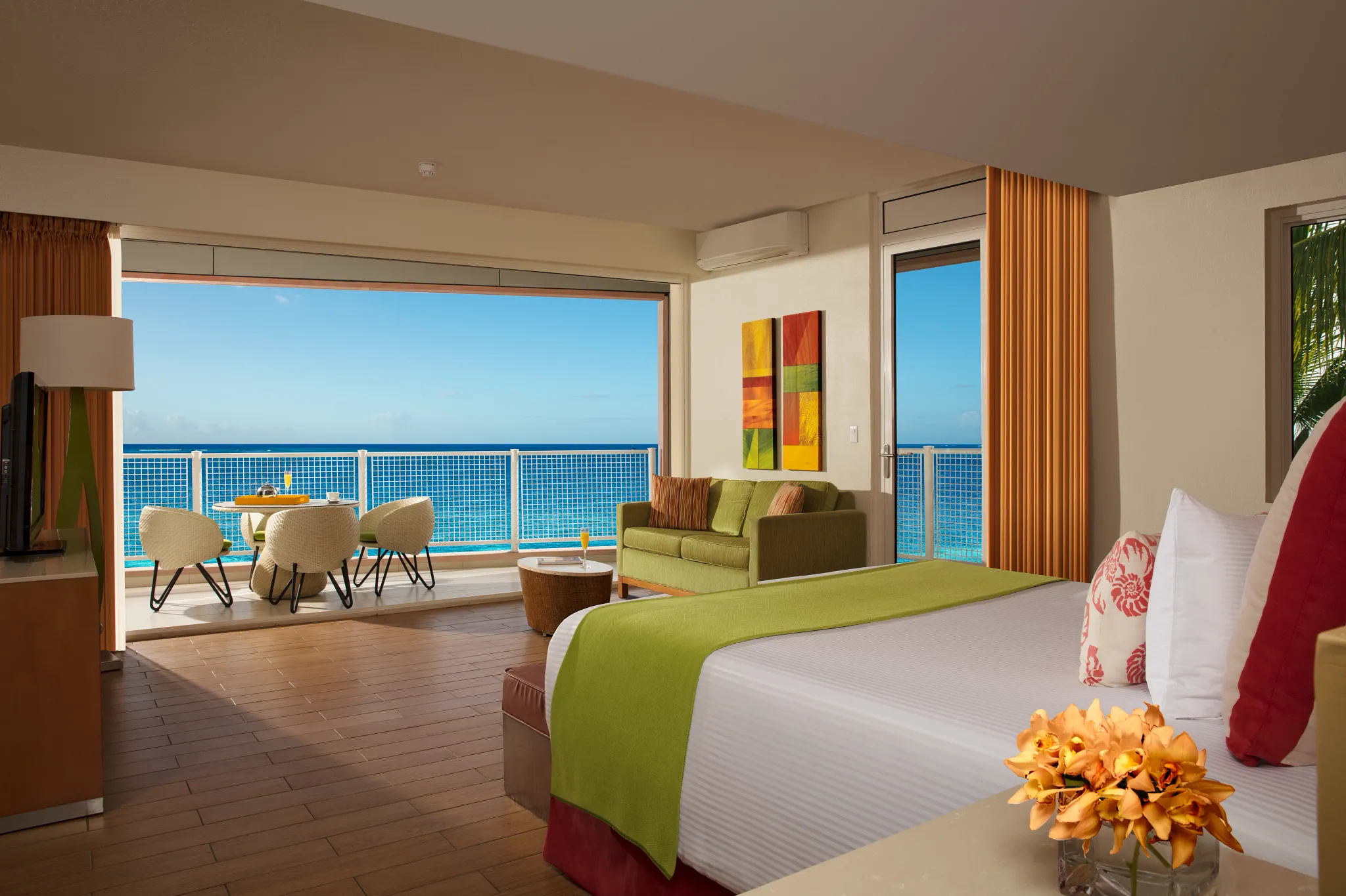 King bed corner hotel room overlooking the ocean