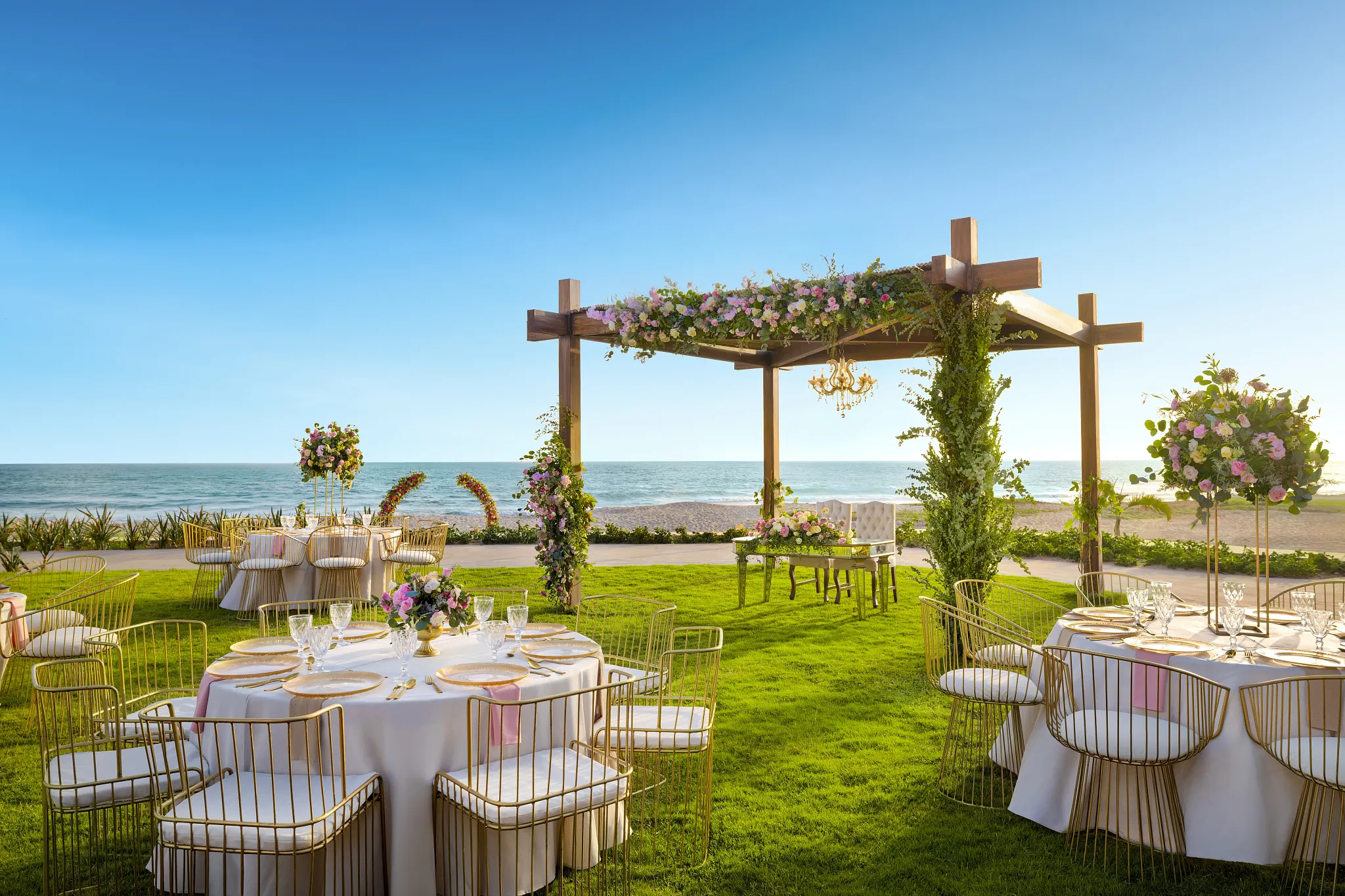 Reception setup with tables and sweetheart table in the garden location
