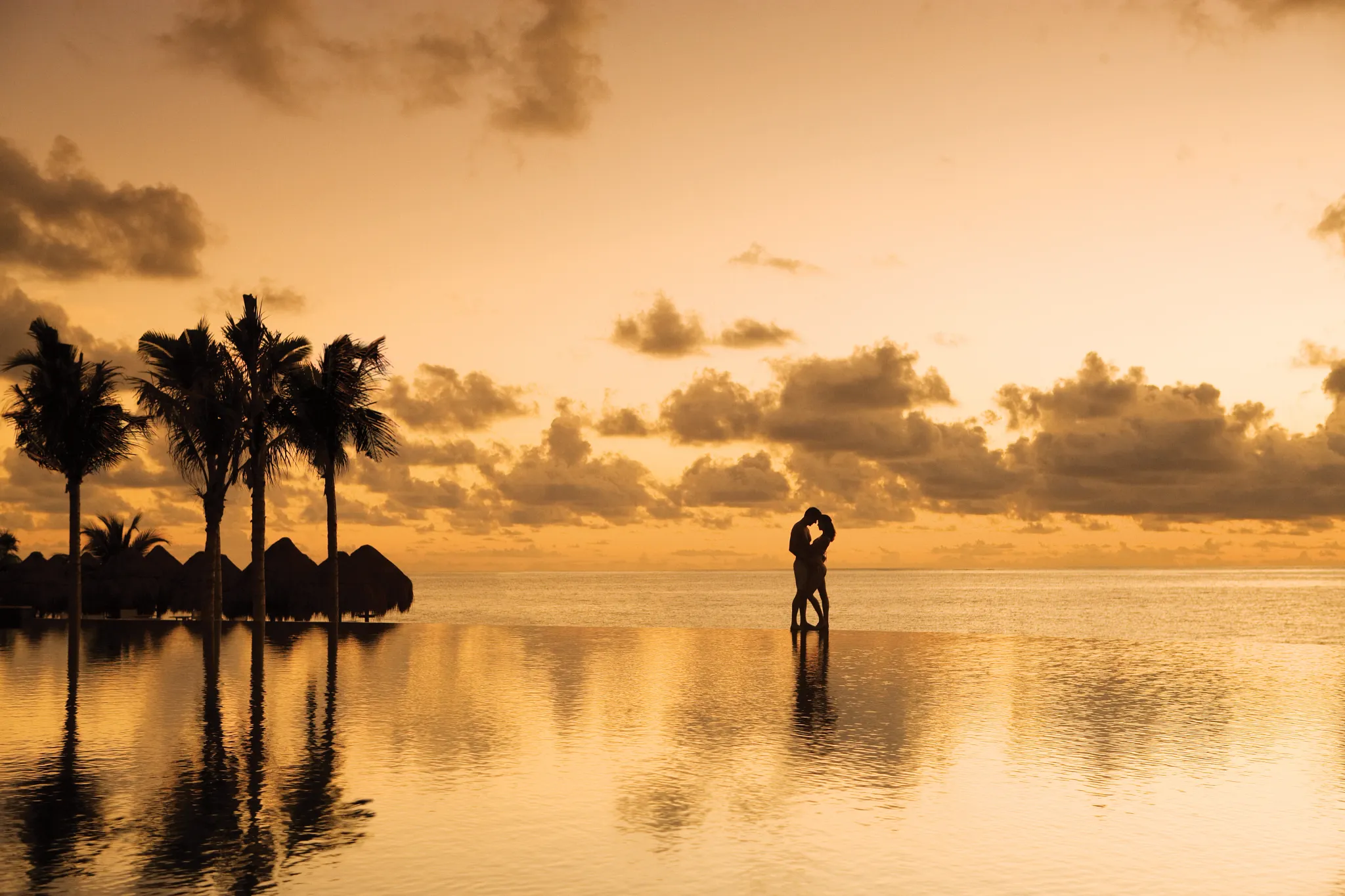silhouette of a couple embracing each other in sunset