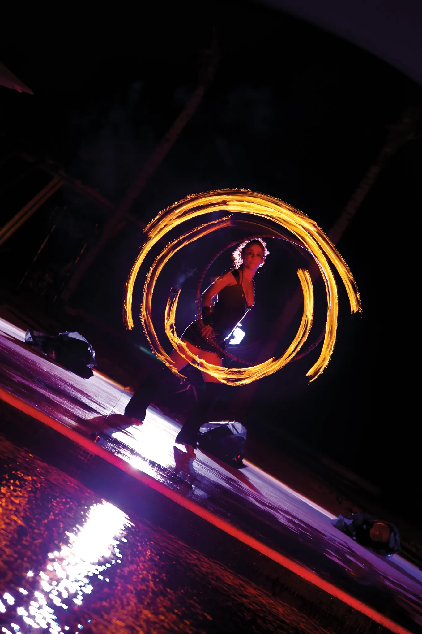 Female performer performing a fire dance show