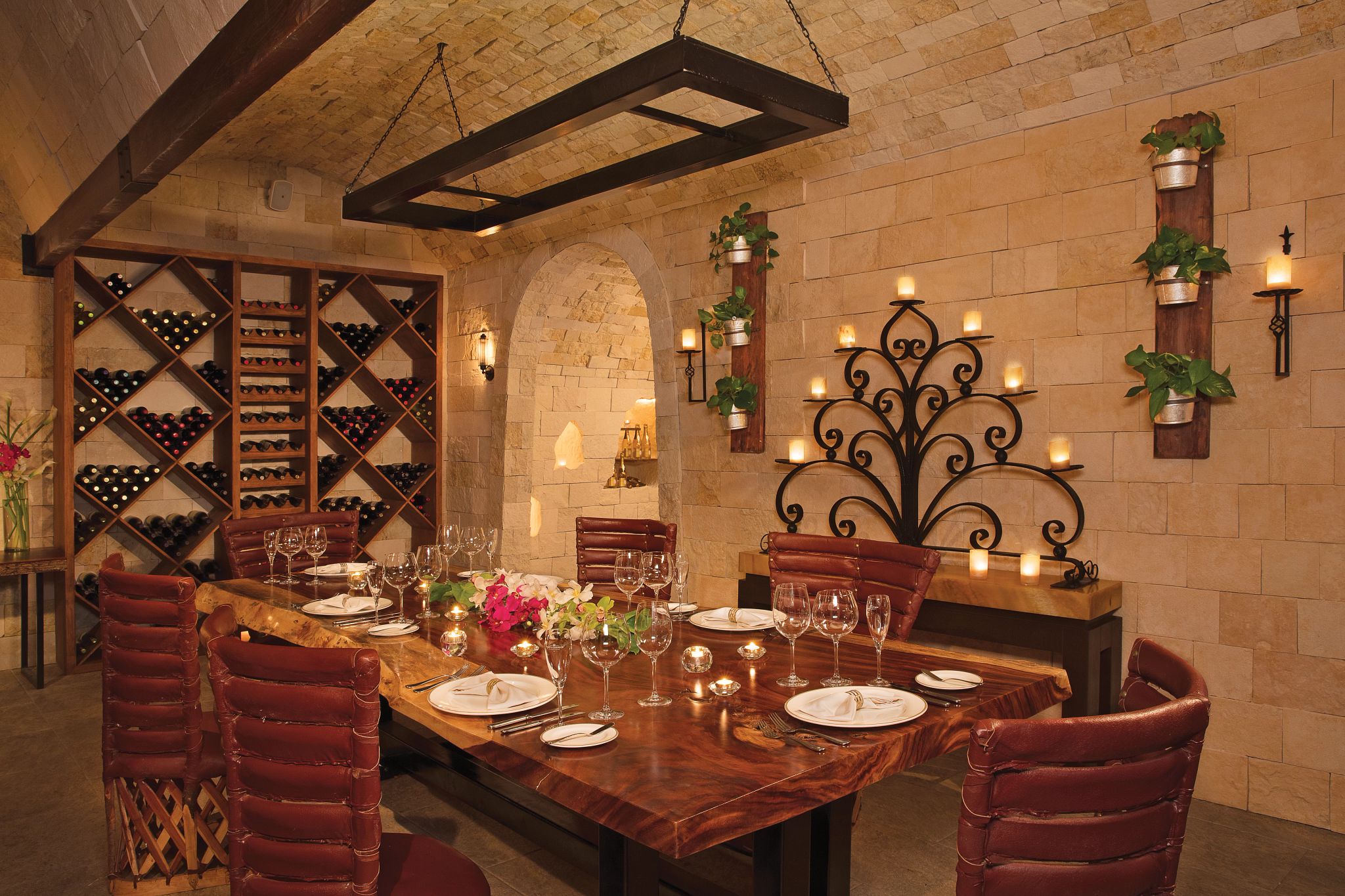 interior of a wine cellar with a table set up for guests