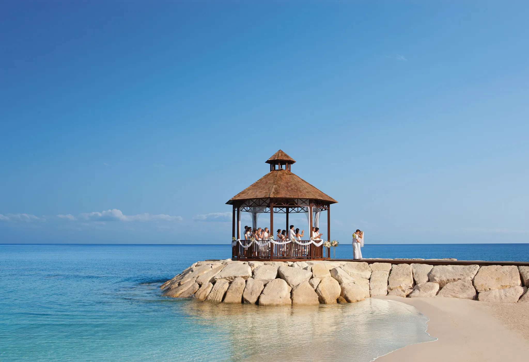 Wedding party at the wedding gazebo over the ocean