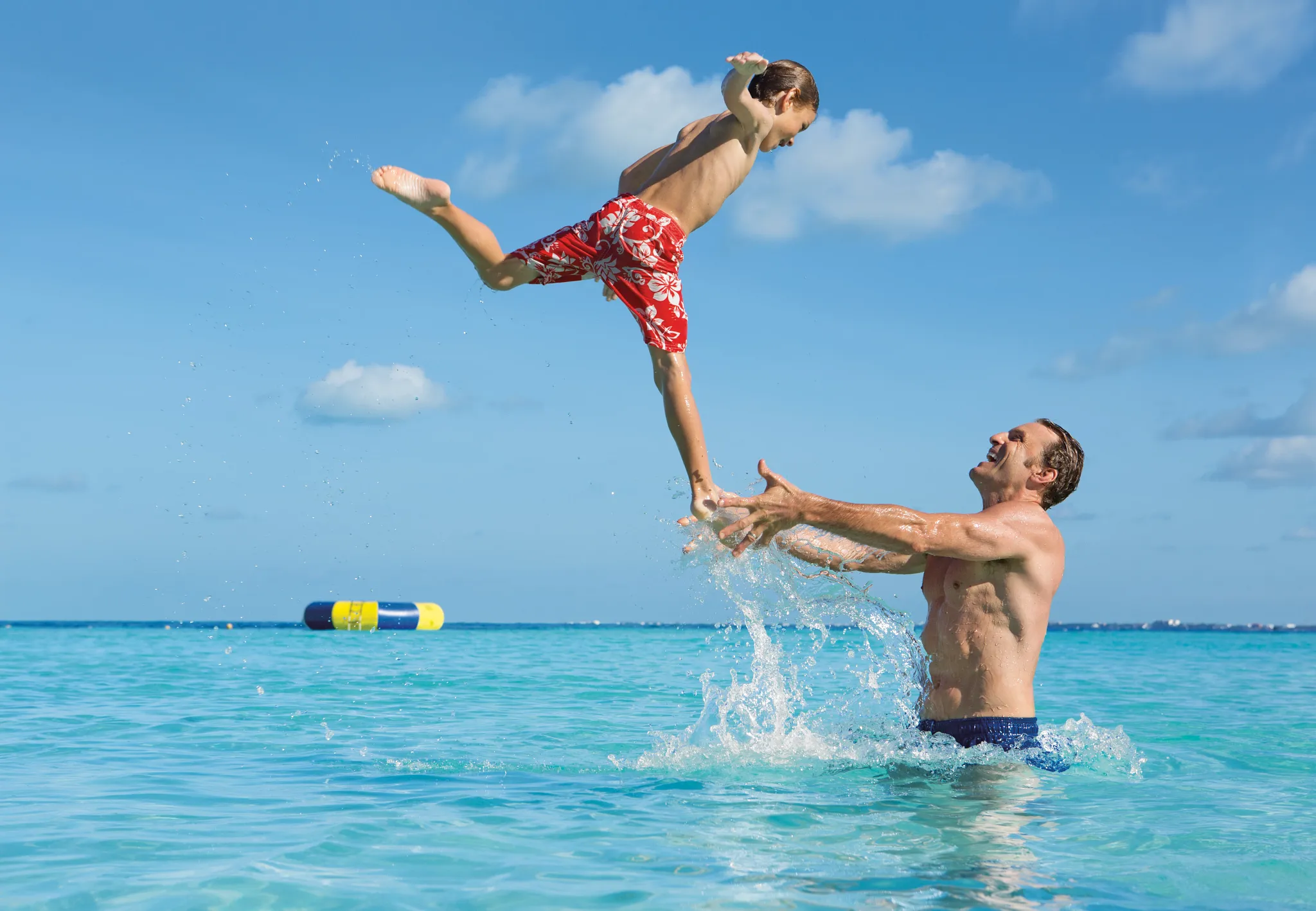 Dad and son in the ocean